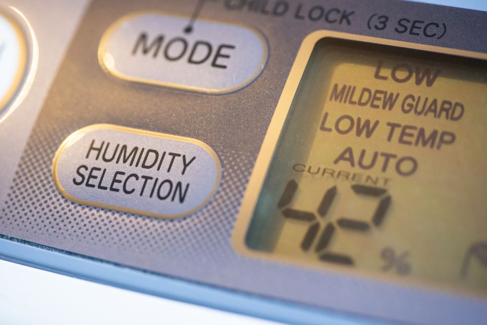 Air Purifier and dehumidifier. Concept for dehumidifying room. Humidity selection button. Humidity percentage display.
