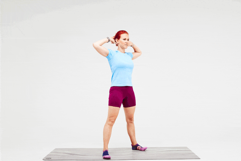 a person doing an air squat with chest stretch
