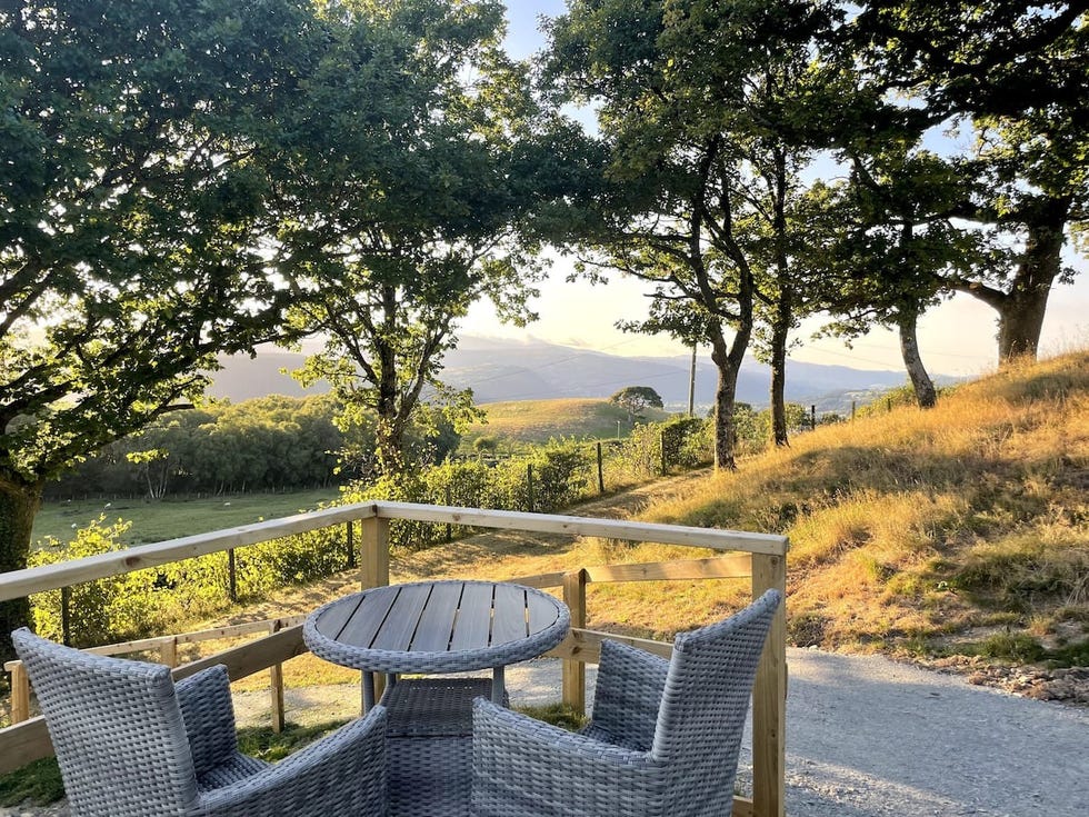 a table and chairs on a deck