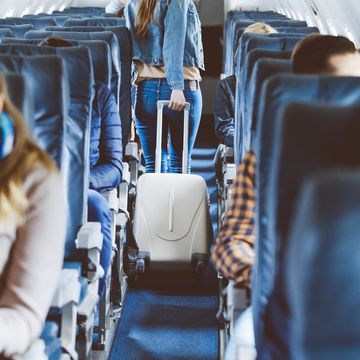 airplane interior with people sitting on seats