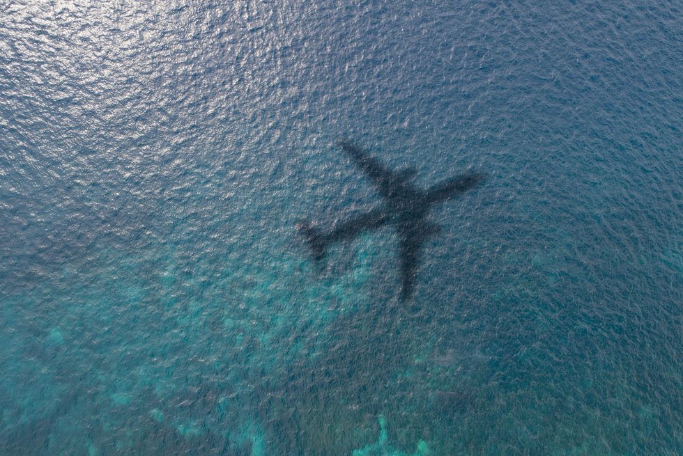 airplane shadow on the ocean
