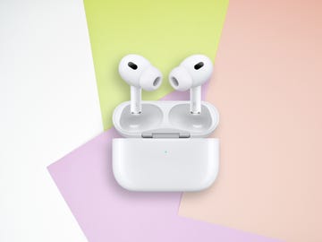 airpods pro 2 earbuds with charging case on colourful background