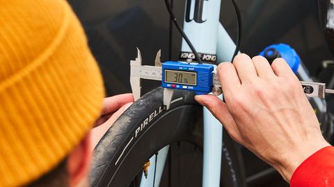 measuring a bike tire with calipers