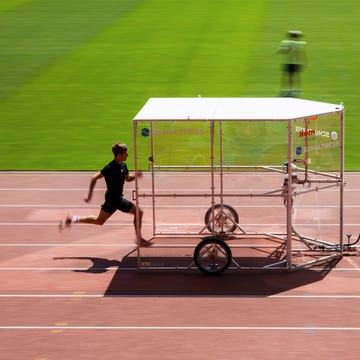 runner behind airshield on track runner behind airshield on track