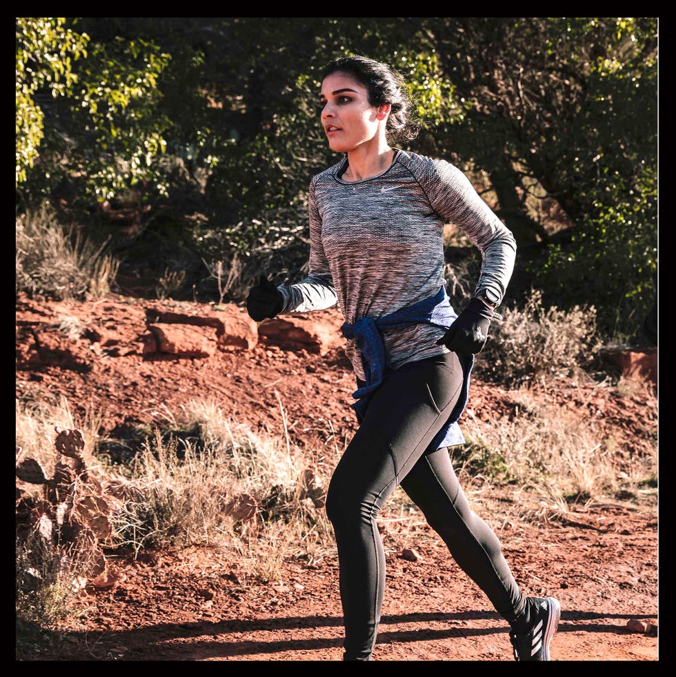 aisha qamar running TIMBERLAND on a trail