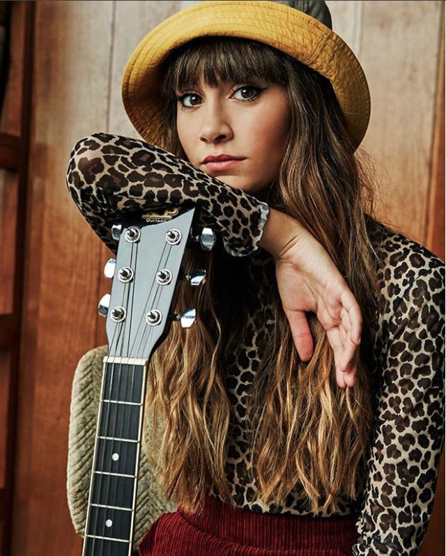 Guitar, Cowboy hat, Hat, Music artist, Cool, Musician, Long hair, Headgear, Photo shoot, Fashion accessory, 