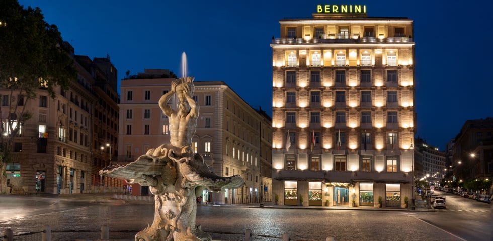 the exterior of the sina bernini bristol hotel in rome at night