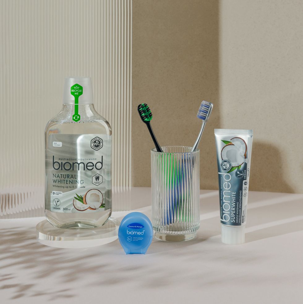 a bottle of toothbrushes and a couple of toothbrushes