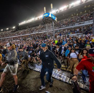 daytona supercross crowd storm course after the conclusion of the event