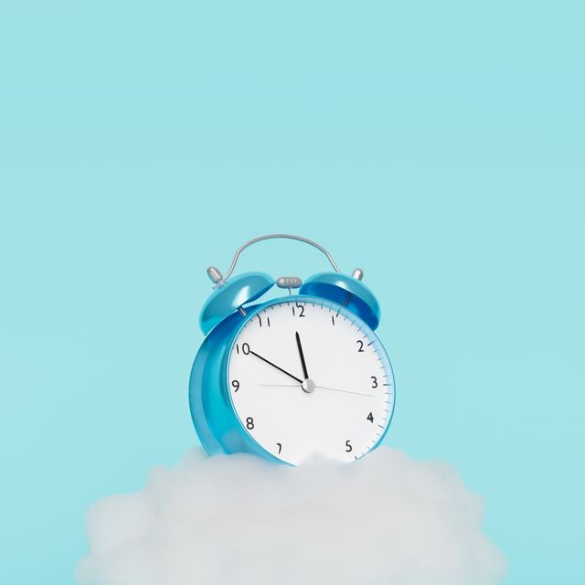 alarm clock on top of a cloud