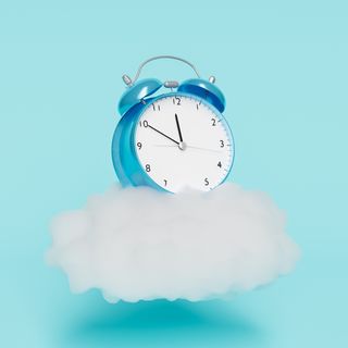 alarm clock on top of a cloud