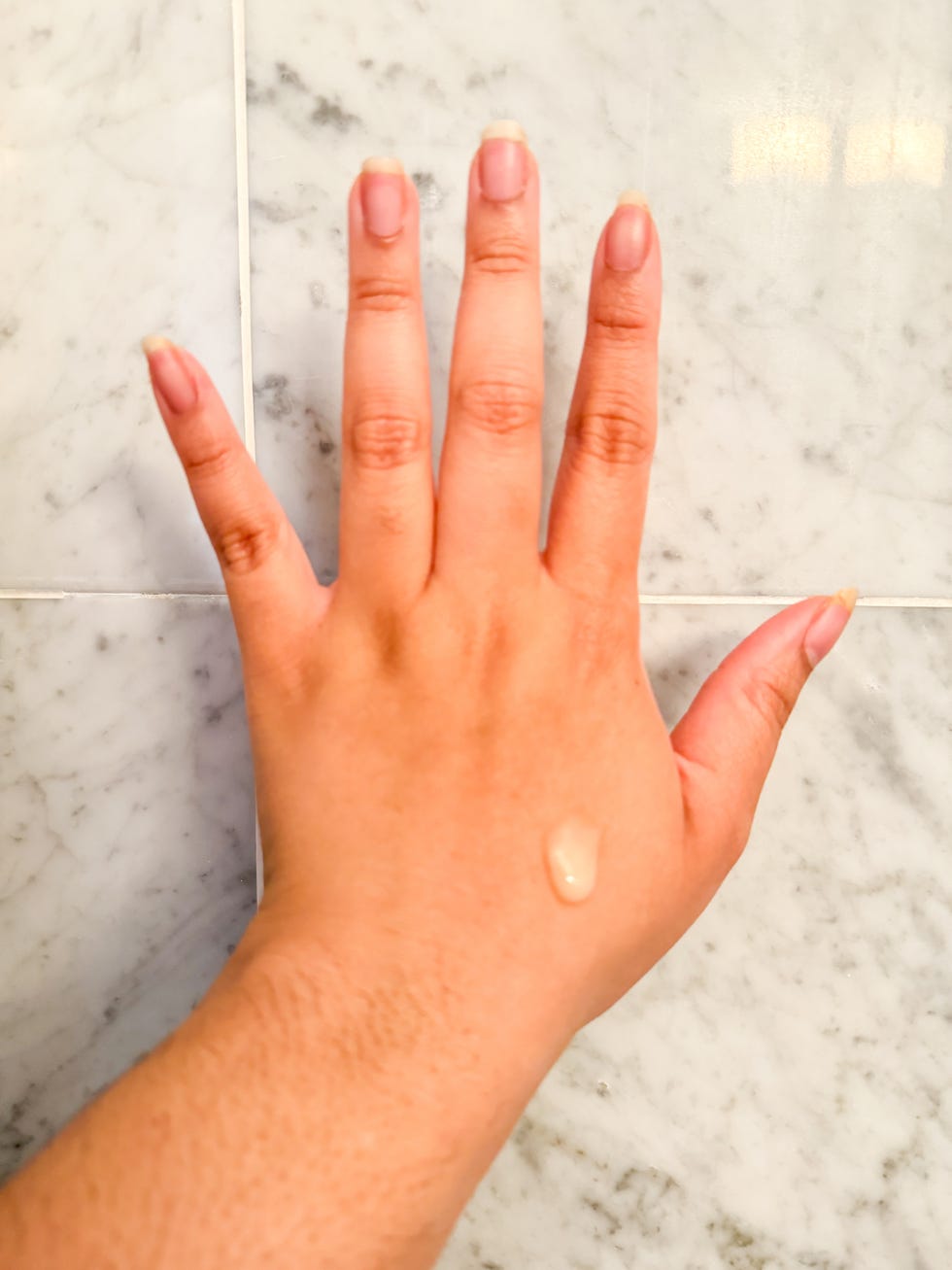 c radical defense antioxidant serum on nicoles hand