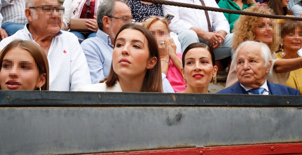 a group of people sitting in a crowd