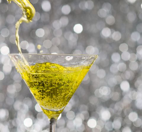 new years colors yellow cocktail with sparkly background