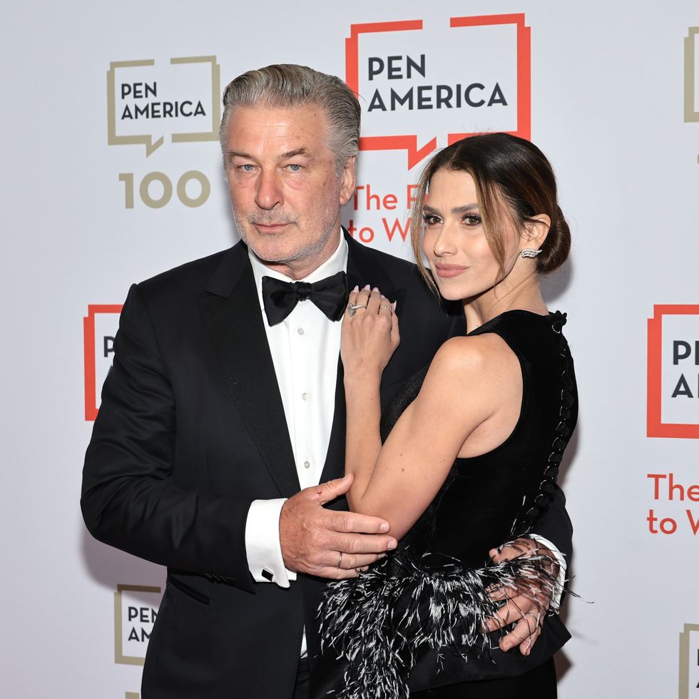 alec baldwin and wife hilaria embracing while posing for photographers at a gala