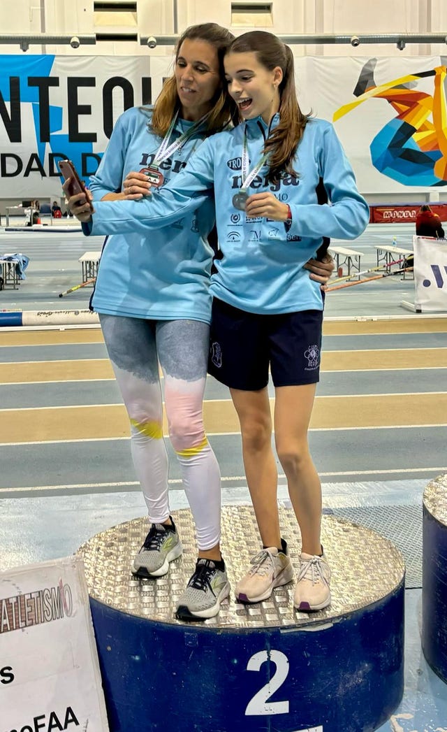 two women in blue shirts