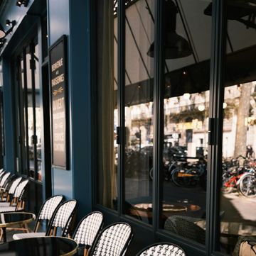a group of tables and chairs outside a building
