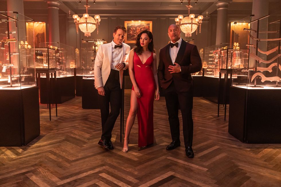 red notice   l r ryan reynolds, gal gadot and dwayne ‘the rock’ johnson star in netflix’s red notice releasing november 12, 2021 written  directed by rawson marshall thurber cr frank masinetflix © 2021