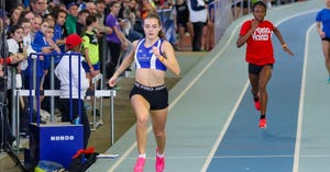 a group of people running on a track