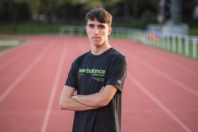 Athlete on a running track wearing a New Balance tshirt
