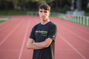 Athlete on a running track wearing a New Balance tshirt