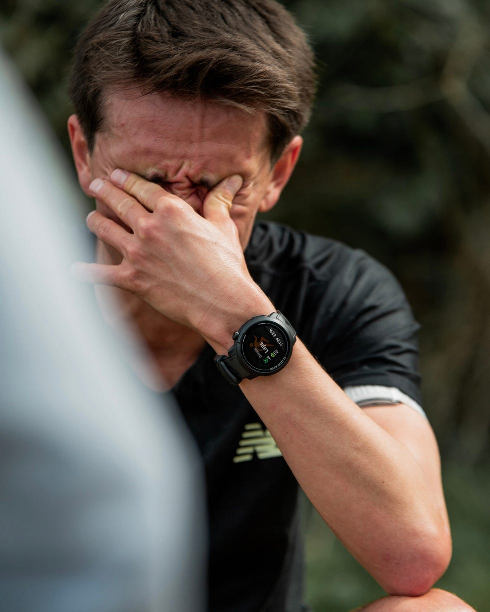 alex yee taking a break and rubbing his eyes with his hand after a tough training run
