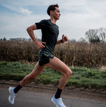 alex yee running fast and determined along a road alex yee running fast and determined along a road