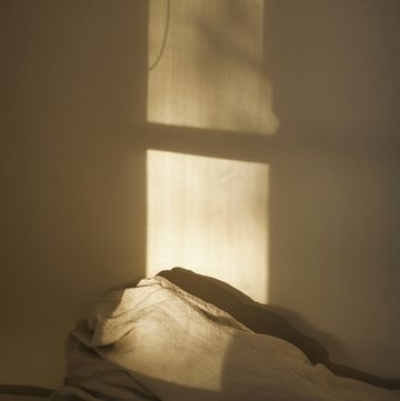 a bed in a dark room