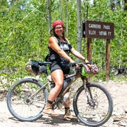 alexandera houchin stops briefly atop carnero pass during the 2019 tour divide which she won and also set the new women's singlespeed record