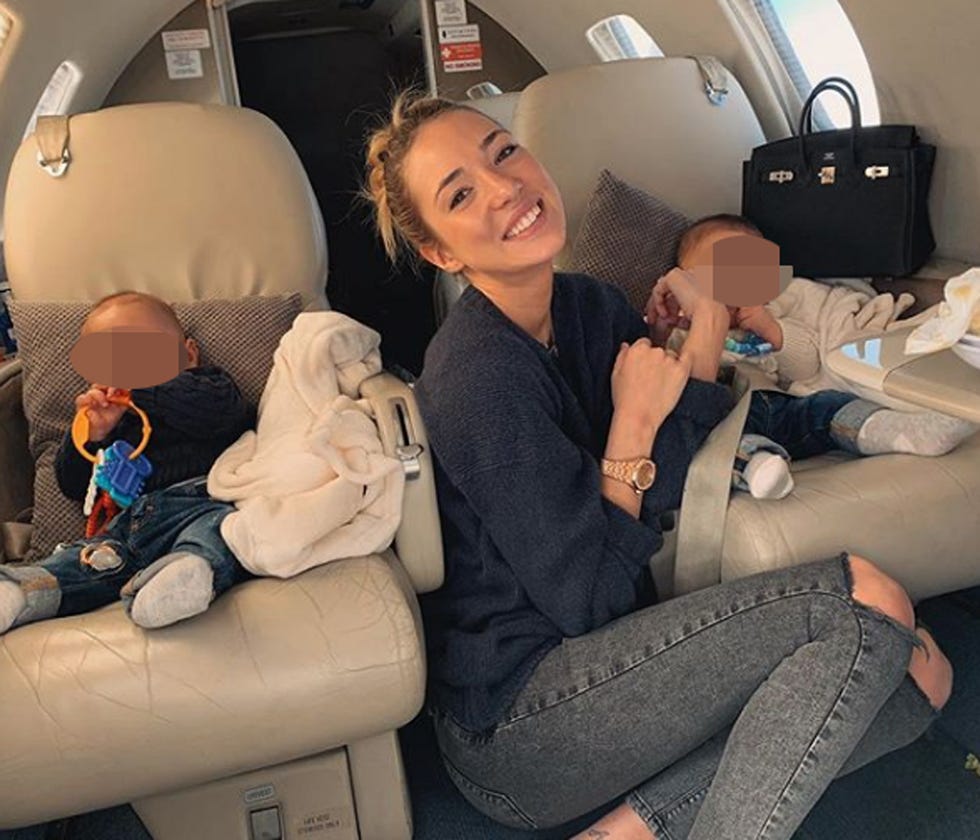 Head restraint, Baby in car seat, Car seat, Passenger, Airline, Comfort, Auto part, Car seat cover, Luxury vehicle, Air travel, 