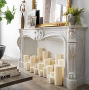 faux fireplace with electric candles in it