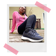 woman in pink hoodie wearing allbirds dasher sneakers outside