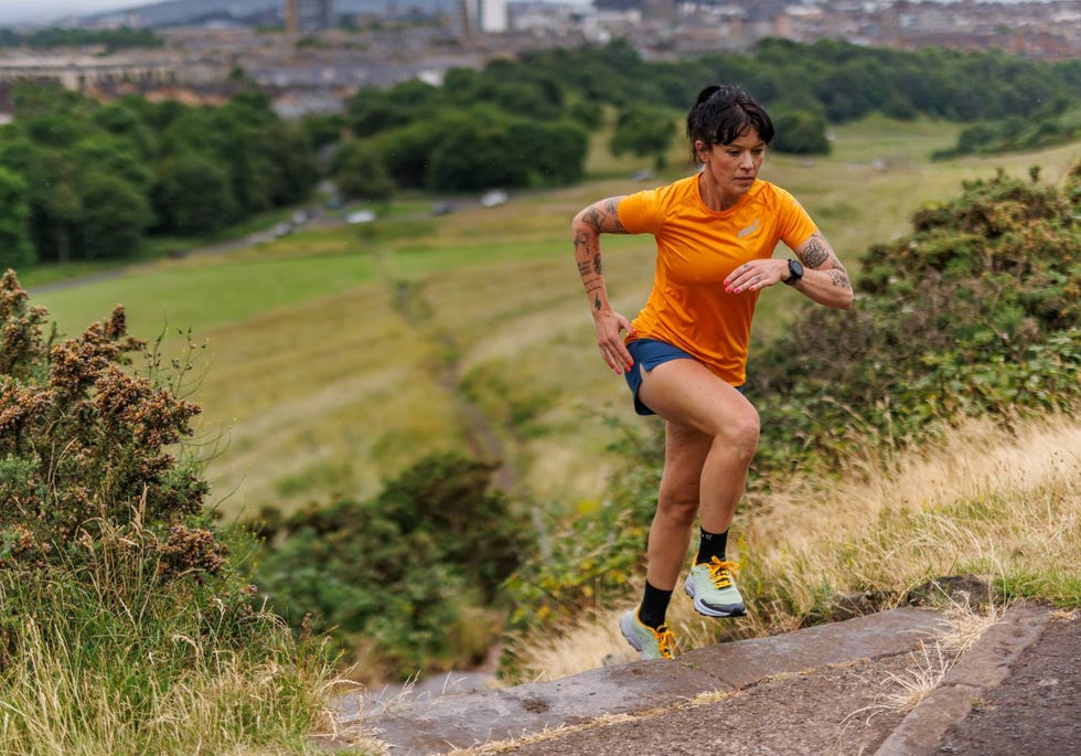 a woman running on a road