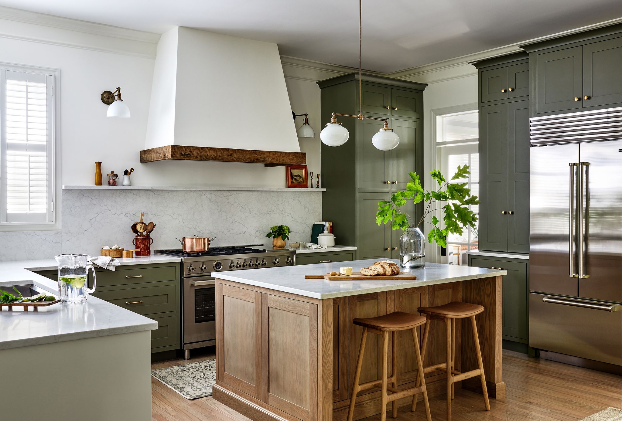 kitchen with an green cabinetry and a kitchen island in the center