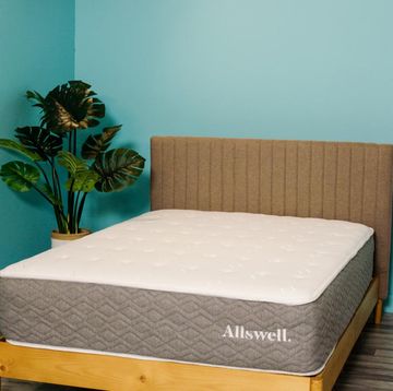 allswell luxe hybrid mattress on a bed frame at good housekeeping