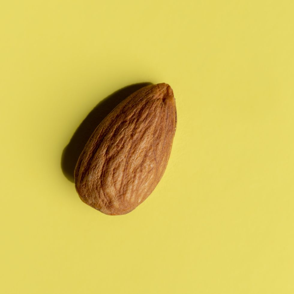 almond on yellow background