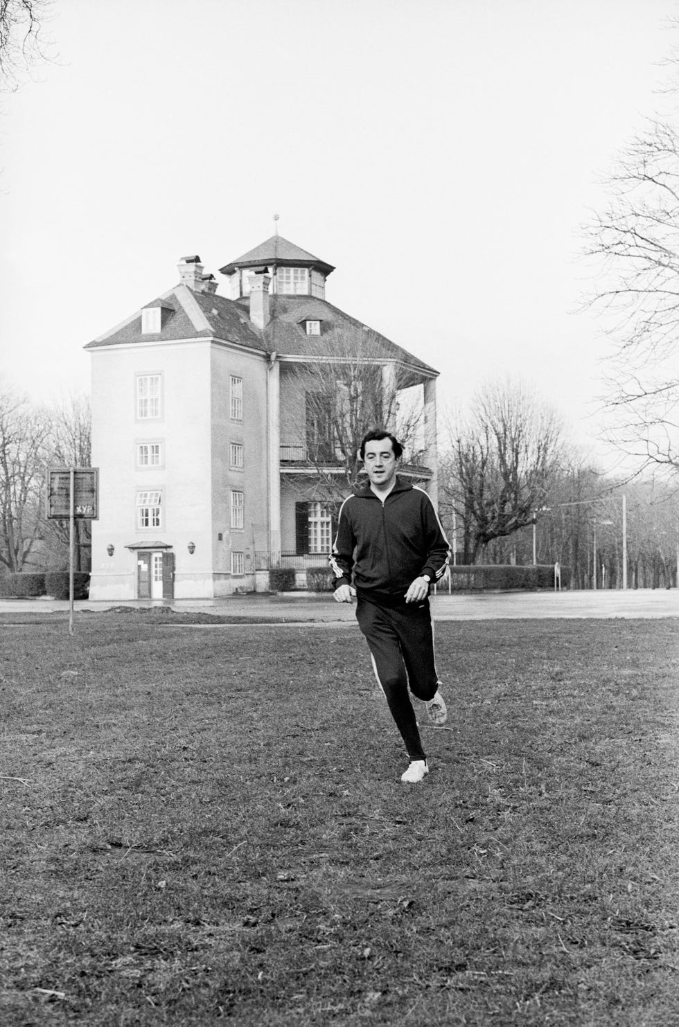 alois mock, austrian minister running in the prater, the lusthaus in the background, photograph, december 1971
