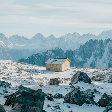 alpine shelter in snow covered dolomites in winter