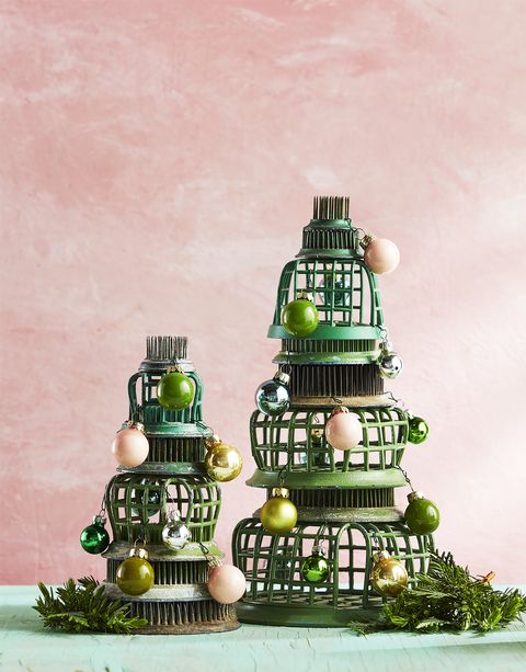 flower frogs stacked in the shape of a tree with tiny ornaments alternative christmas tree