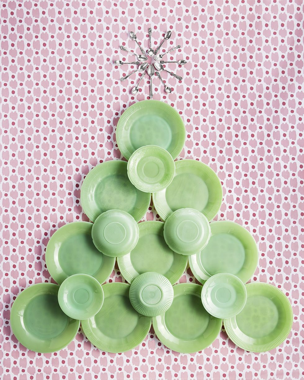 jadeite plates hung on the wall in the shape of a christmas tree alternative christmas tree