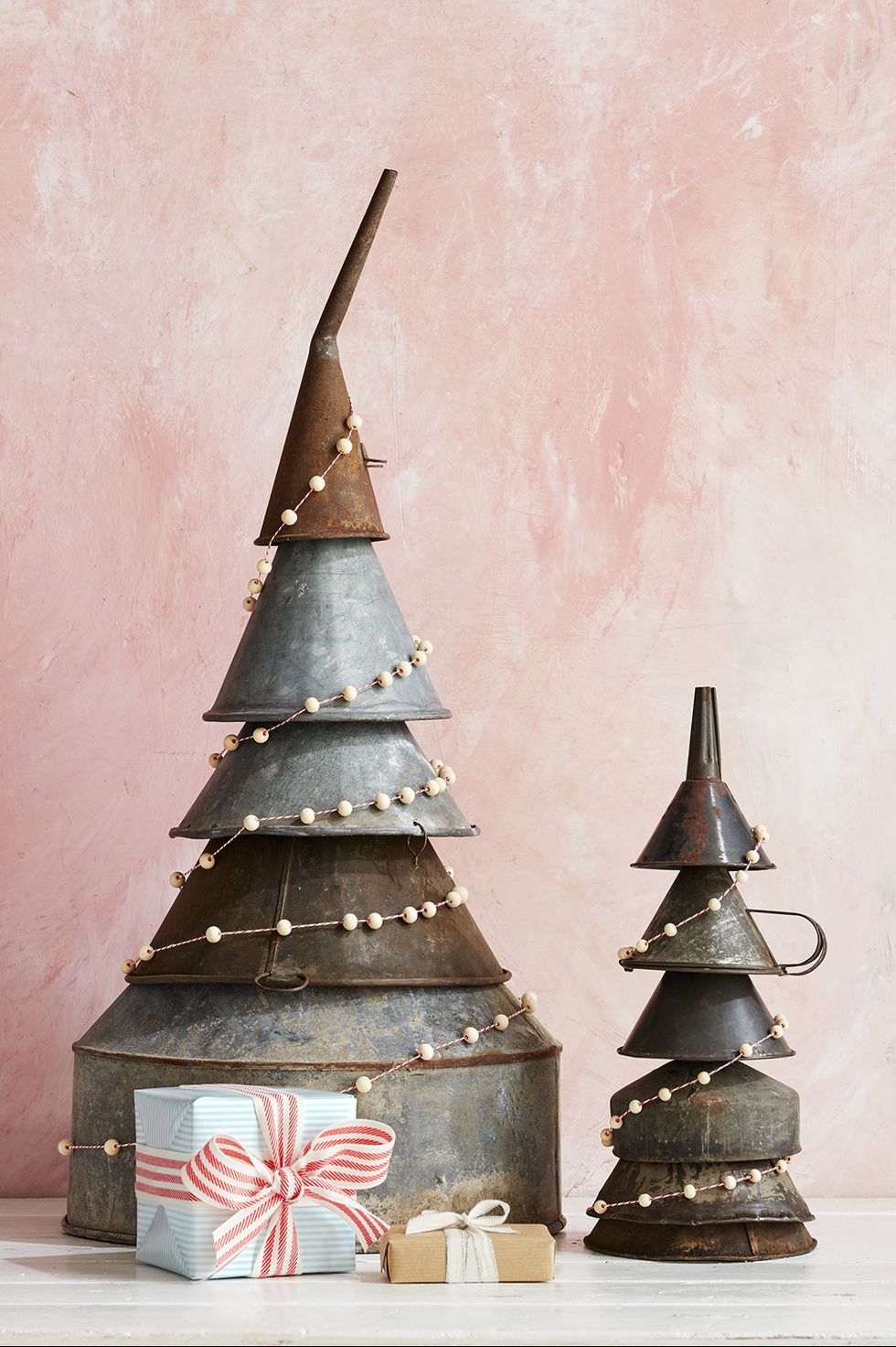 metal funnels stacked to make a tree shape for an alternative christmas tree