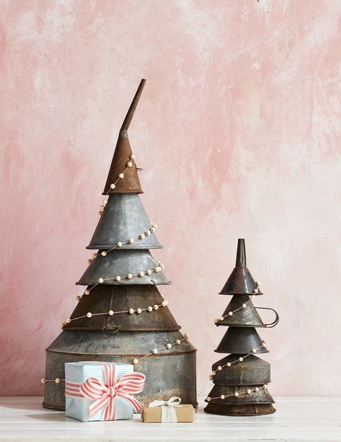 metal funnels stacked to make a tree shape for an alternative christmas tree