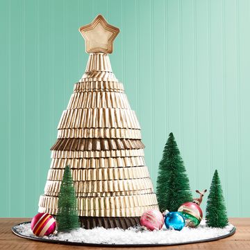 old metal tart pans stacked in the shape of a christmas tree