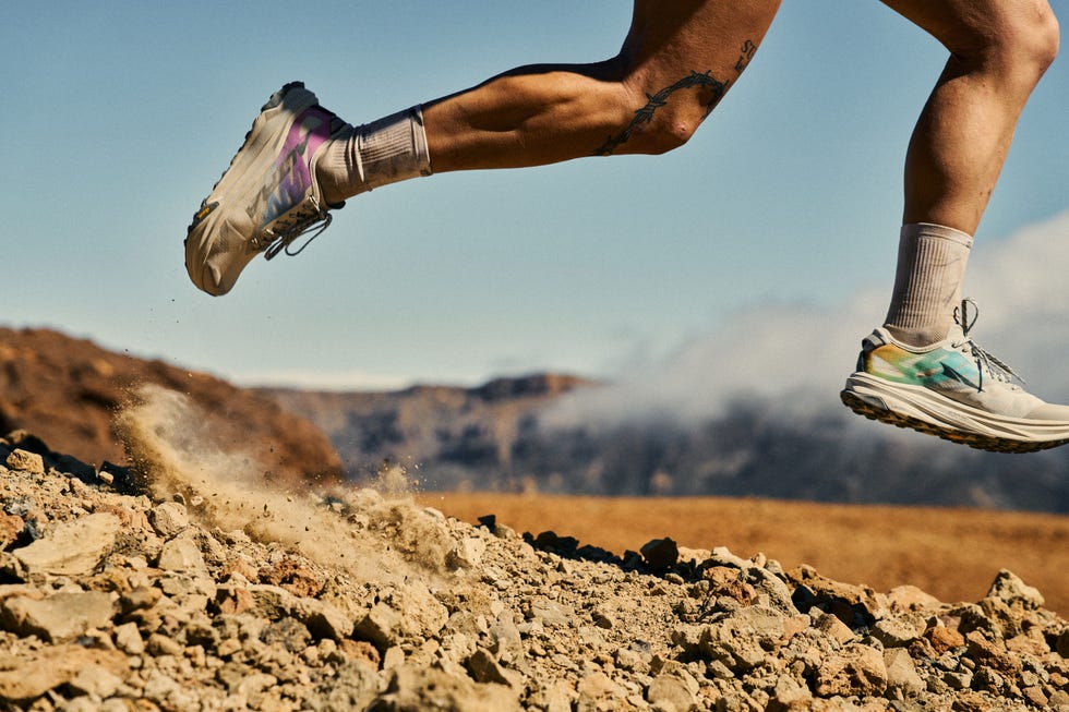 close up of a trail runner's lower legs running