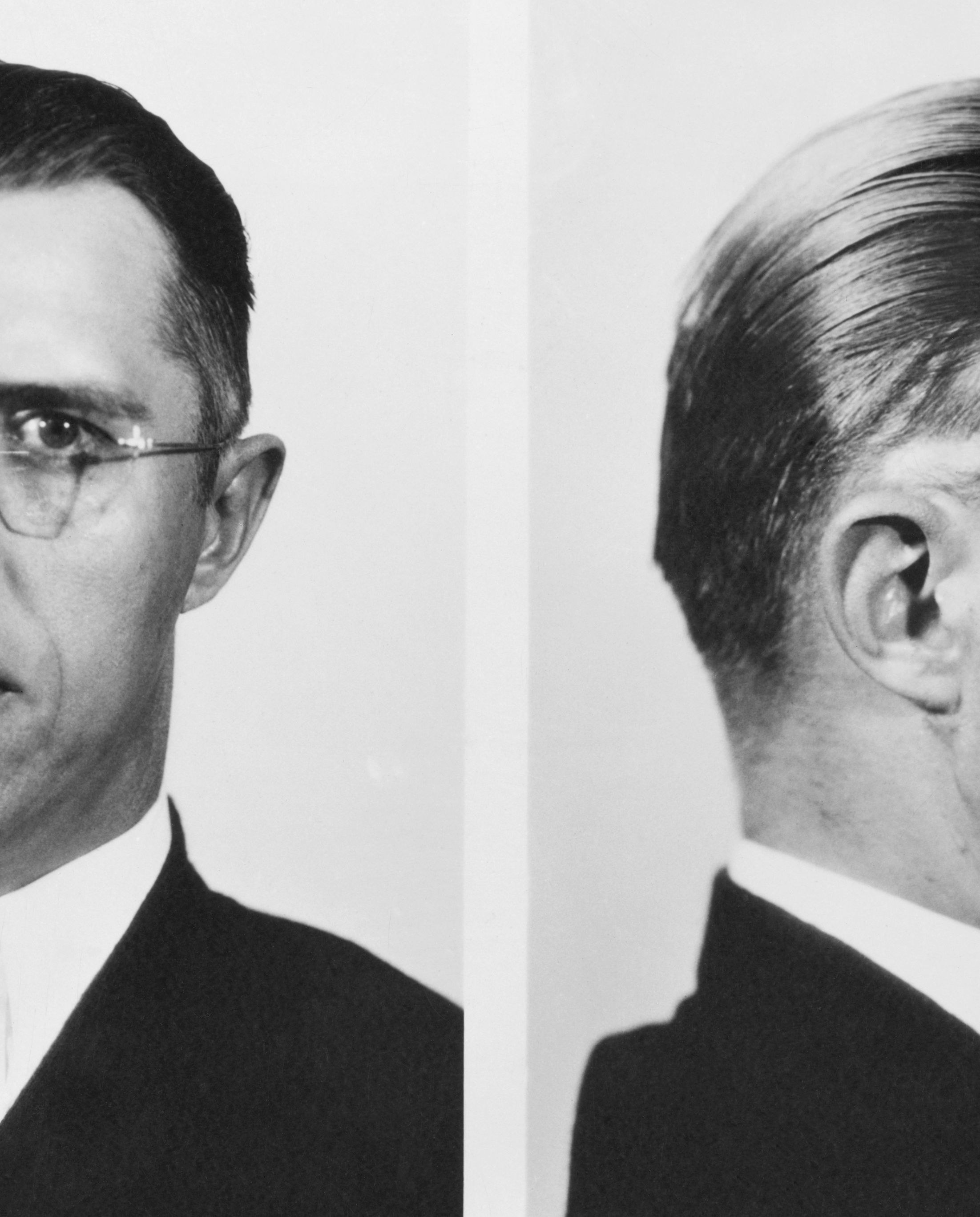 police mugshot of a man in glasses