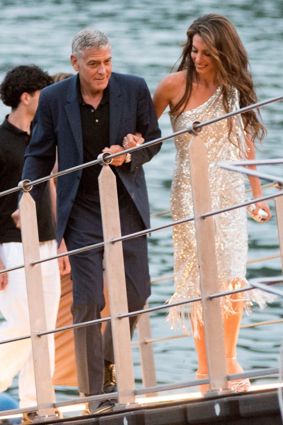 bguk_3311600 *exclusive* tremezzo, italy web must call for pricing *pictures taken on 30/07/2025* the famous couple is working on organising an exclusive and unprecedented event that will involve 16 illustrious guests to raise funds for "the clooney foundation for justice." the exclusive event will take place on lake como between august 13th and 15th and will be hosted at the de santis family properties: the grand hotel tremezzo, passalacqua in moltrasio, and villa sola cabiati, recently cited by "the times" as having hosted taylor swift's vacation. in the exclusive photographs of this reportage, we see the welcome from the general manager of the properties, silvio vettorello, who is presumably overseeing the organisation with the hotel's teams and under the guidance of the landlady, valentina de santis. amal clooney will personally oversee the details to make the occasion special and stylish. among the wealthy guests, the presence of important businessmen and the couple's closest friends is not ruled out. the top secret list could it's expected to be surprising and include brad pitt, giulia roberts, jennifer lopez, and even the obama family. the clooneys and some friends went to dinner at the grand hotel in tremezzo and will visit the other properties involved in the coming days. a cocktail party is also planned at villa oleandra, where the couple has already been vacationing for 10 days with their children, ella and alexandre. **strictly not available for online subscription deals** pictured: amal clooney, george clooney backgrid uk 1 august 2025 uk: +44 208 344 2007 / uksales@backgrid.com usa: +1 310 798 9111 / usasales@backgrid.com *pictures containing children please pixelate face prior to publication* bguk_3311600 *exclusive* tremezzo, italy web must call for pricing *pictures taken on 30/07/2025* the famous couple is working on organising an exclusive and unprecedented event that will involve 16 illustrious guests to raise funds for "the clooney foundation for justice." the exclusive event will take place on lake como between august 13th and 15th and will be hosted at the de santis family properties: the grand hotel tremezzo, passalacqua in moltrasio, and villa sola cabiati, recently cited by "the times" as having hosted taylor swift's vacation. in the exclusive photographs of this reportage, we see the welcome from the general manager of the properties, silvio vettorello, who is presumably overseeing the organisation with the hotel's teams and under the guidance of the landlady, valentina de santis. amal clooney will personally oversee the details to make the occasion special and stylish. among the wealthy guests, the presence of important businessmen and the couple's closest friends is not ruled out. the top secret list could it's expected to be surprising and include brad pitt, giulia roberts, jennifer lopez, and even the obama family. the clooneys and some friends went to dinner at the grand hotel in tremezzo and will visit the other properties involved in the coming days. a cocktail party is also planned at villa oleandra, where the couple has already been vacationing for 10 days with their children, ella and alexandre. **strictly not available for online subscription deals** pictured: amal clooney, george clooney backgrid uk 1 august 2025 uk: +44 208 344 2007 / uksales@backgrid.com usa: +1 310 798 9111 / usasales@backgrid.com *pictures containing children please pixelate face prior to publication*