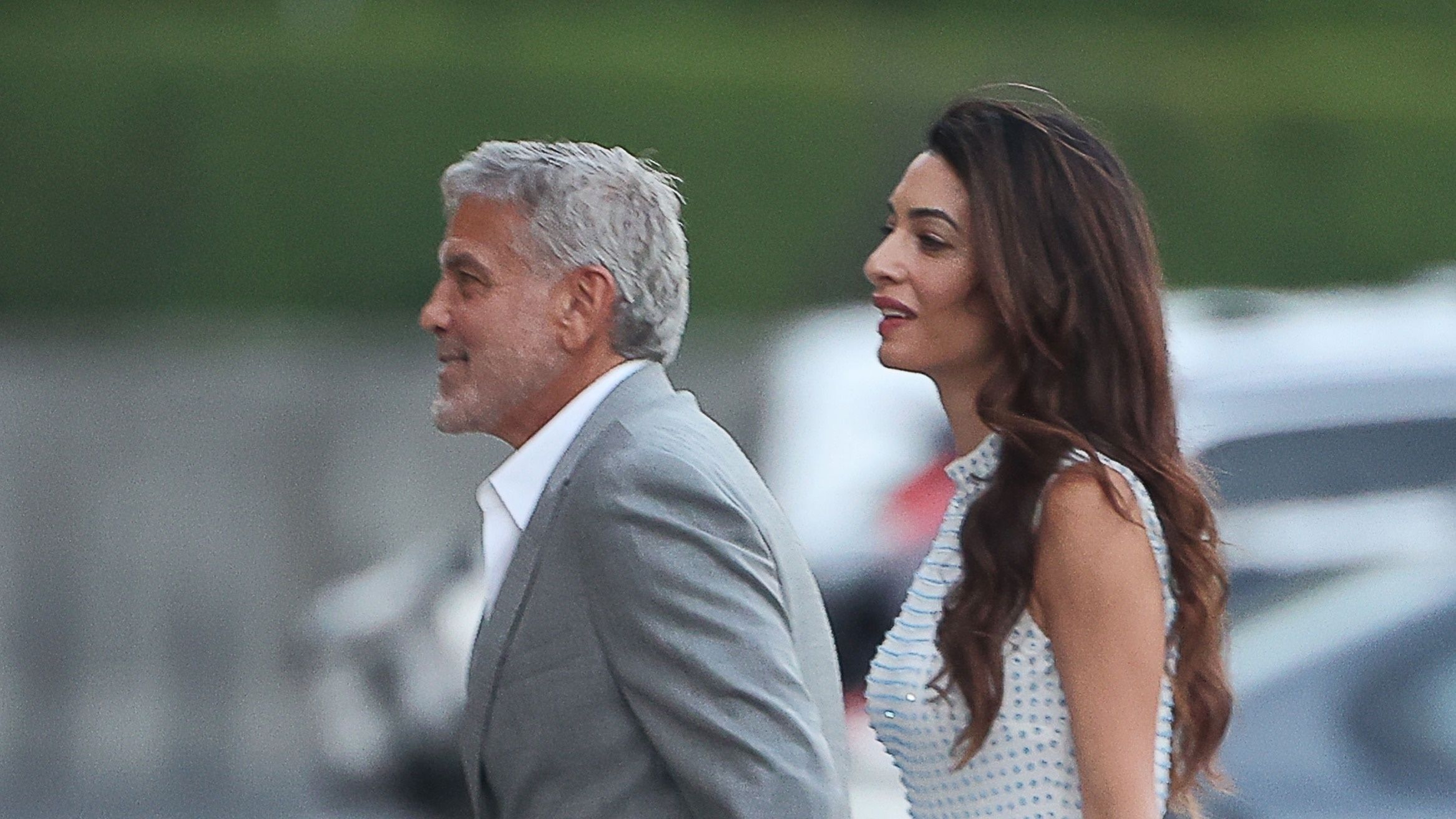 Amaland Porn - Amal Clooney wears feathered mini dress while out in Lake Como