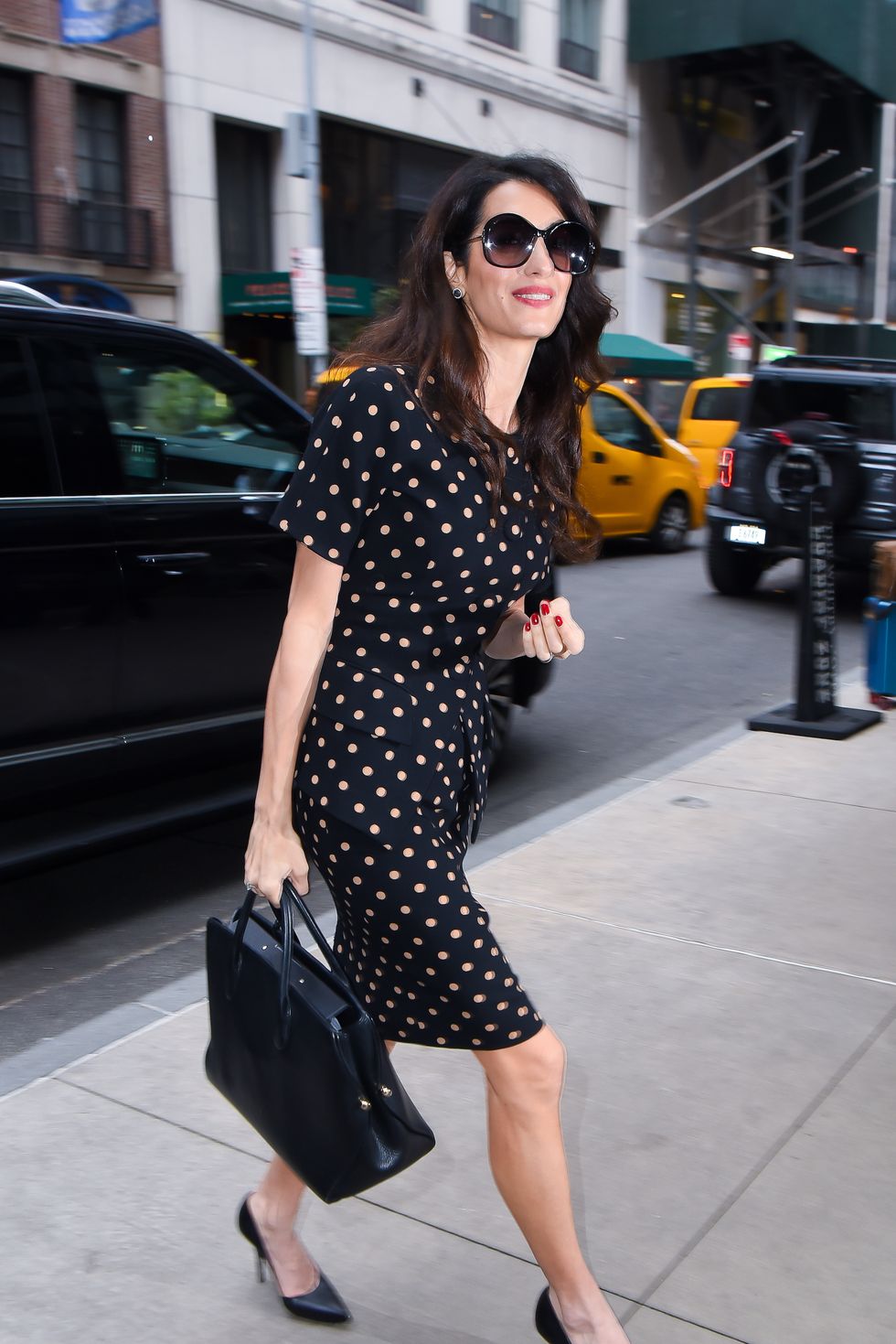 Amal Clooney Wore Classic Sneakers With a Chic Spring Dress