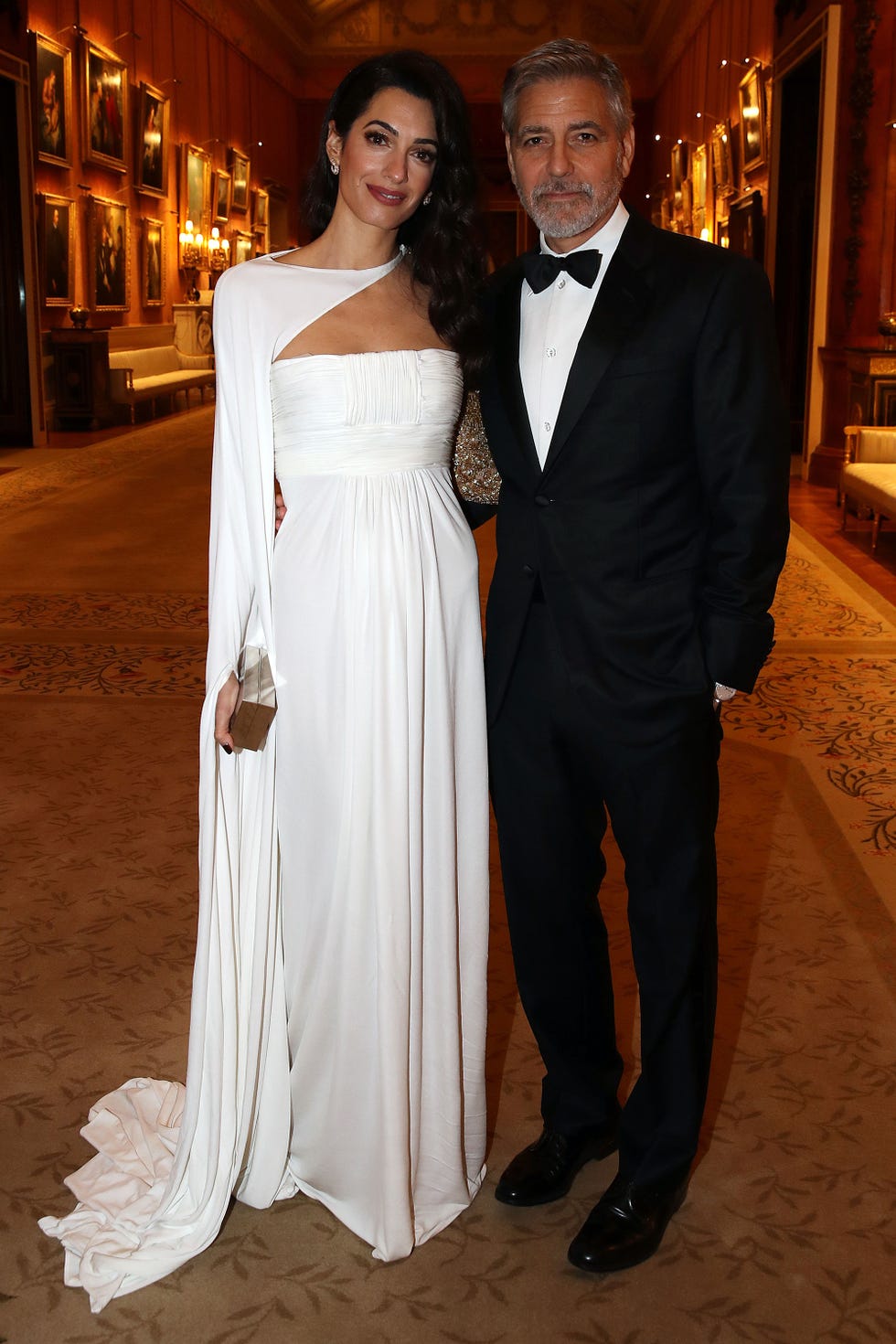 Amal and George Clooney at Buckingham Palace