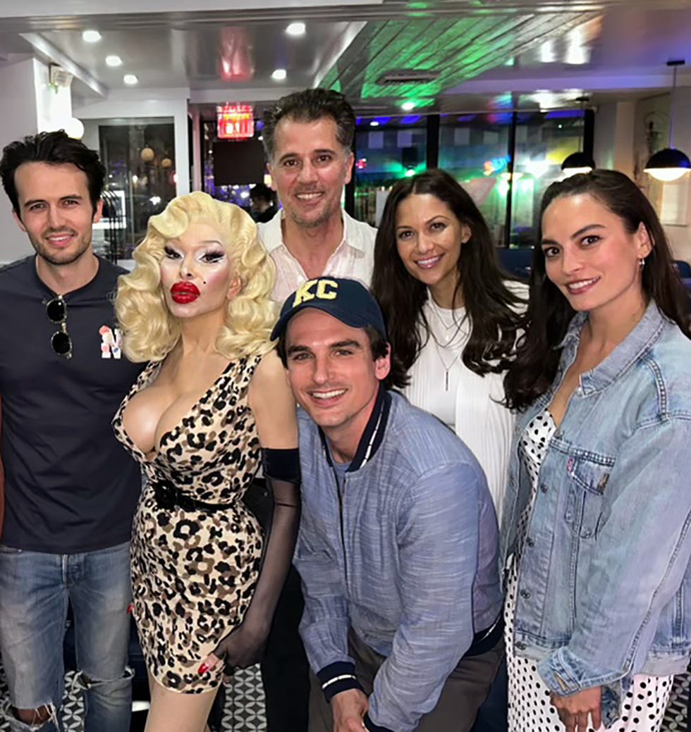 amanda lepore posing with some of the diner 24 team